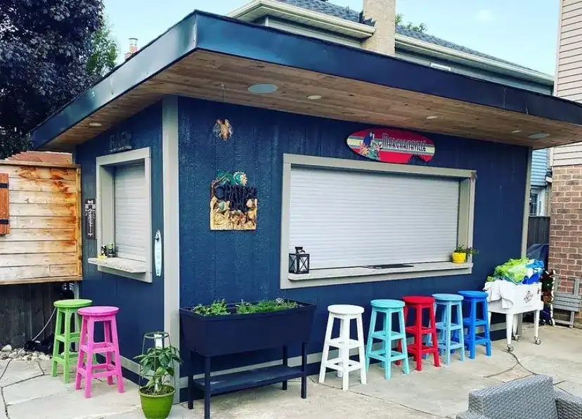 The bar with its roll-up window and stools along the counter