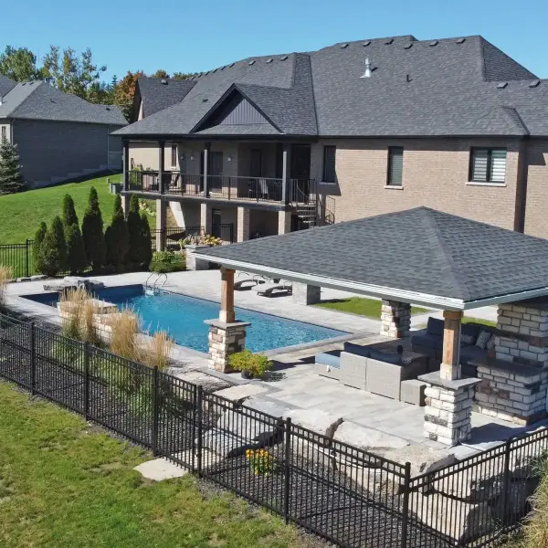 Finished home with the pool, pavilion and lawn
