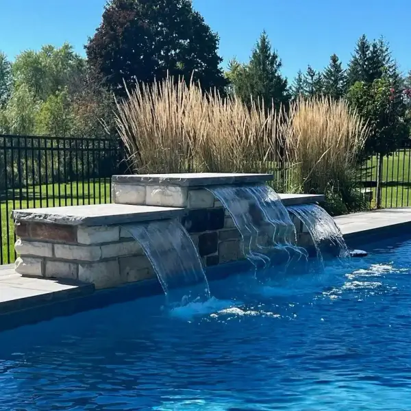 Pool with a stone spillway water feature