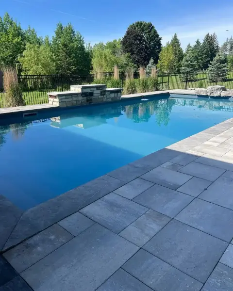 Pool and paver patio looking across the yard