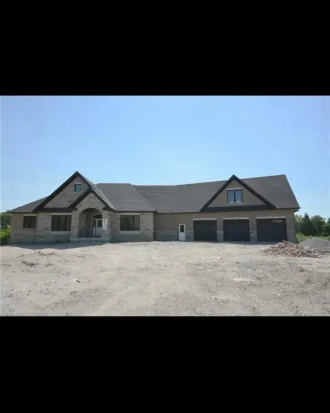 The property before, house on a bare dirt lot