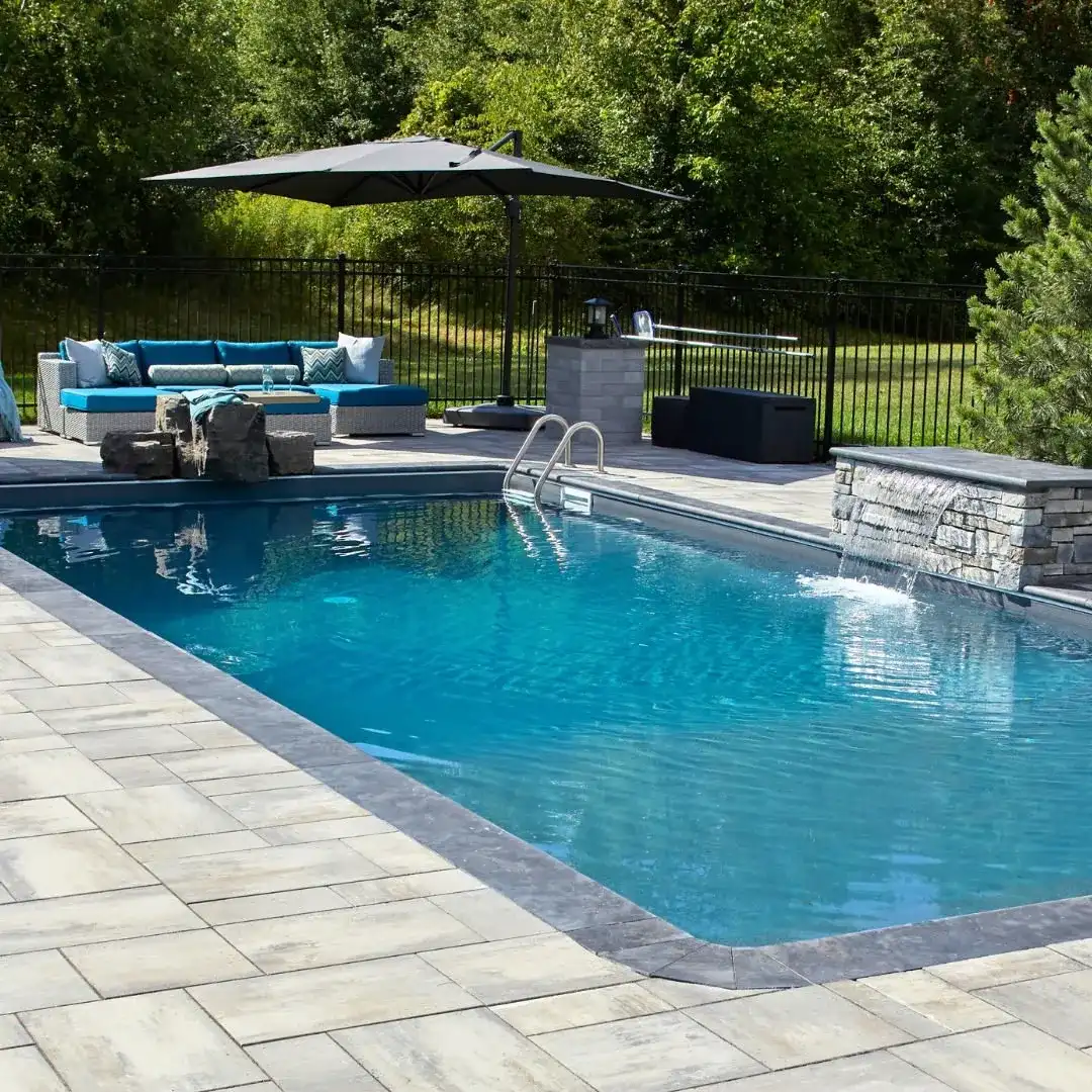 Poolside lounge with an umbrella and sectional seating