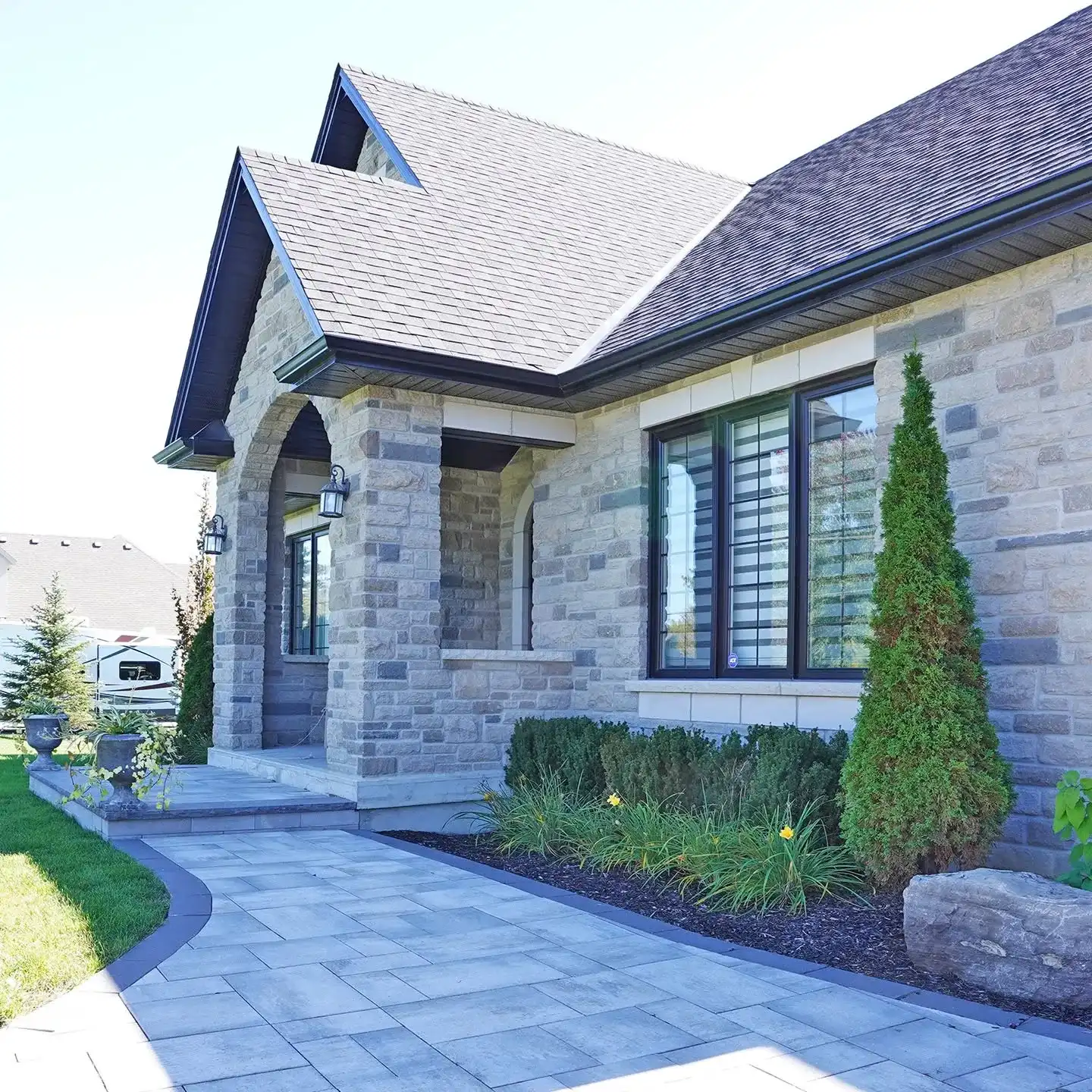 Home with a front water feature and pool