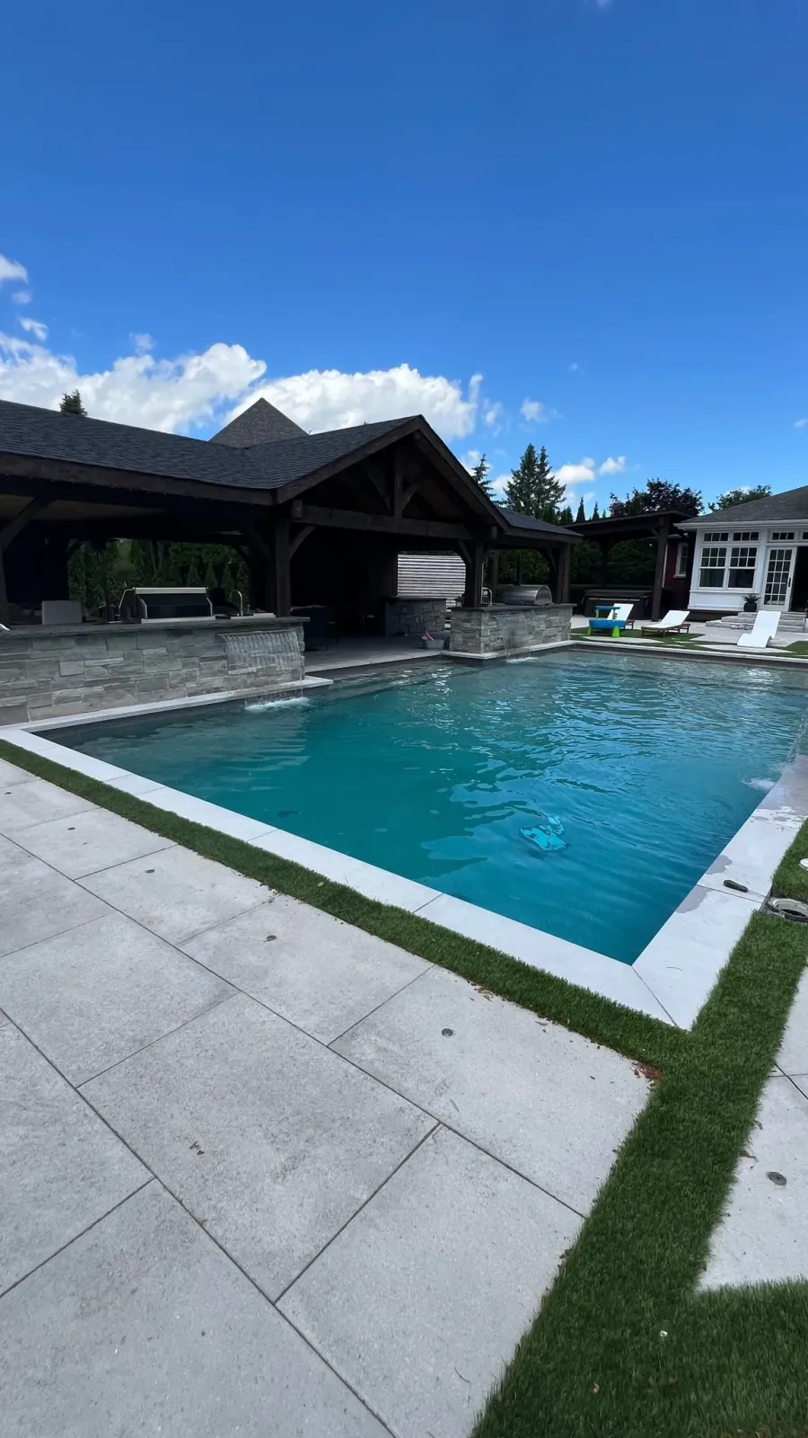 Pool and home lit at dusk