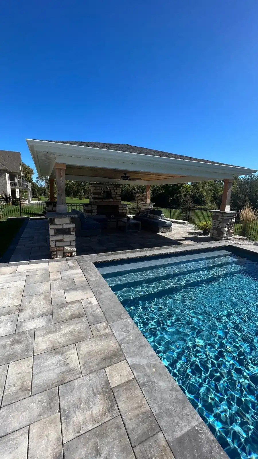 Pool with a pergola and patio