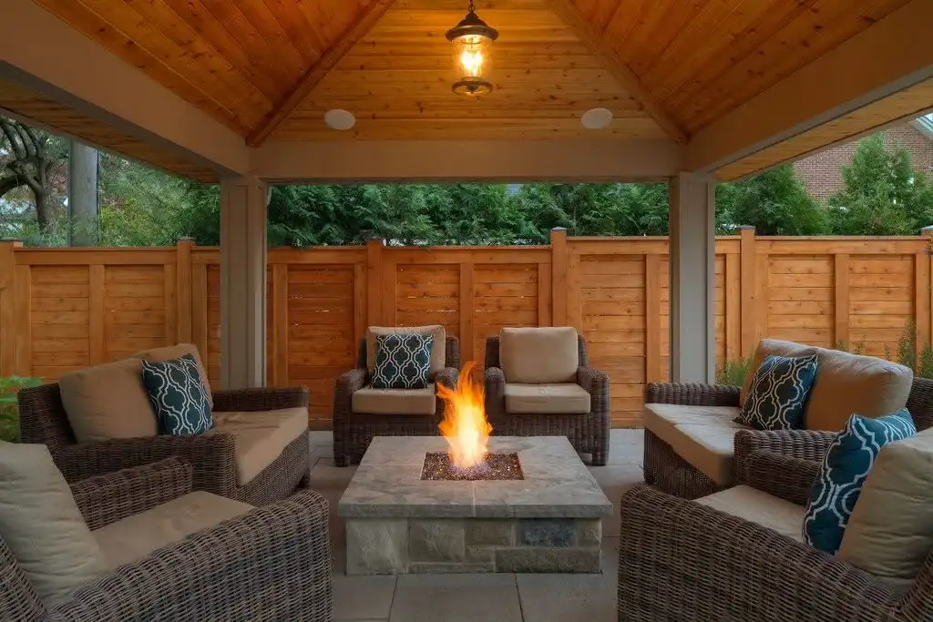 Covered pavilion with a fire table and lounge seating