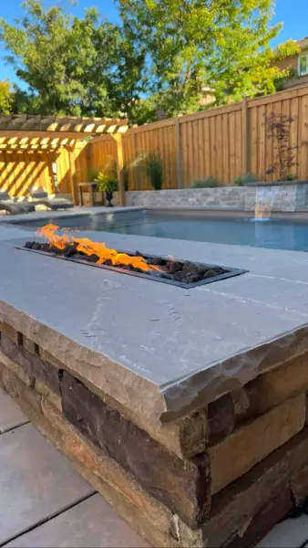 Linear fire feature along the pool edge