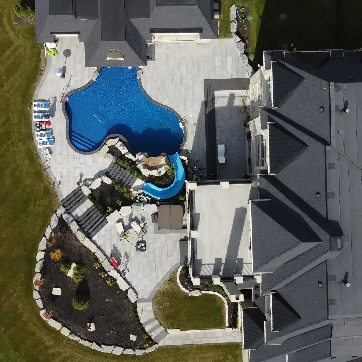 Overhead view of a freeform pool and water slide
