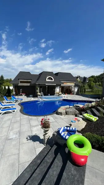 Pool, pavilion and loungers across the patio