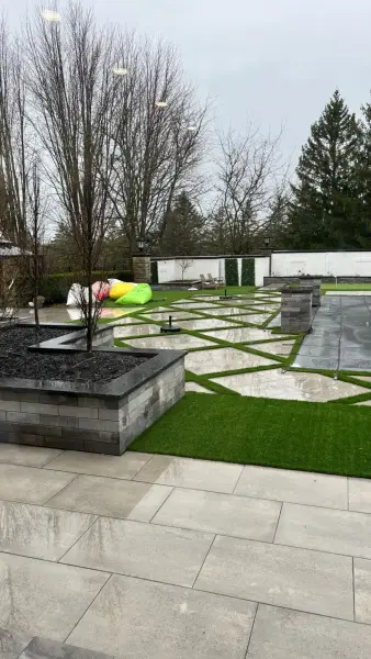 Floating pavers set into artificial turf