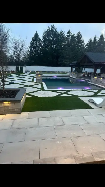 The pool and patio lit up at night