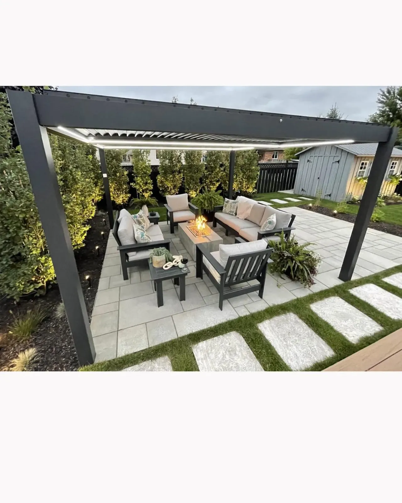 Pergola over an outdoor lounge with a fire feature