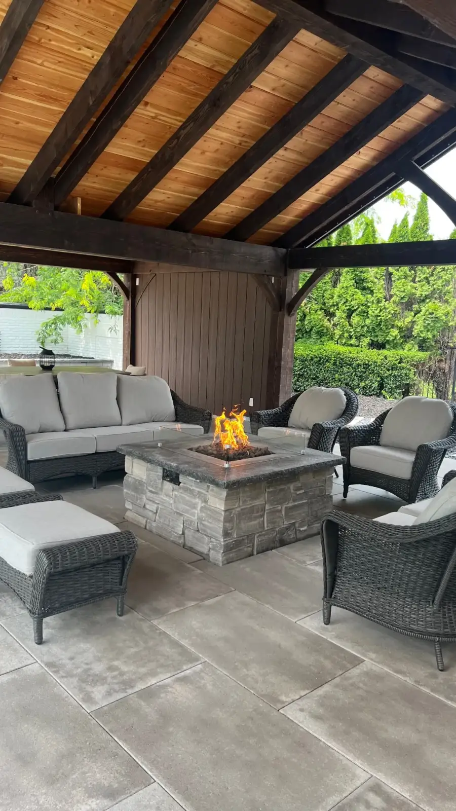 Covered pavilion with a fire table and lounge seating