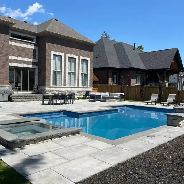 Wide view of the home, patio and pool