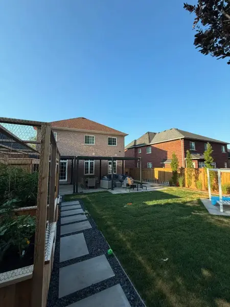 Finished backyard with pavers and turf