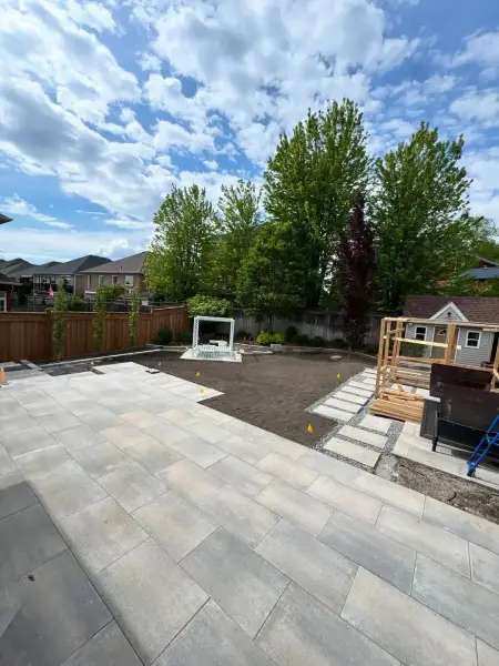 Wide paver patio and lawn after completion