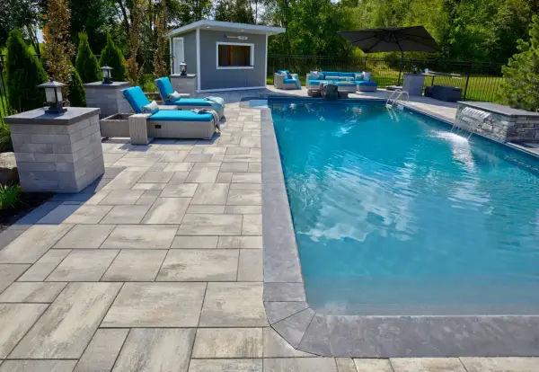 Wide view across the pool to the house