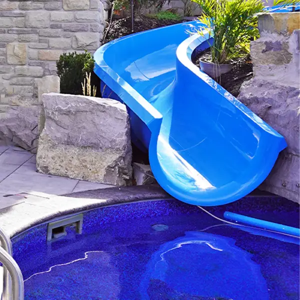 The blue water slide landing in the pool