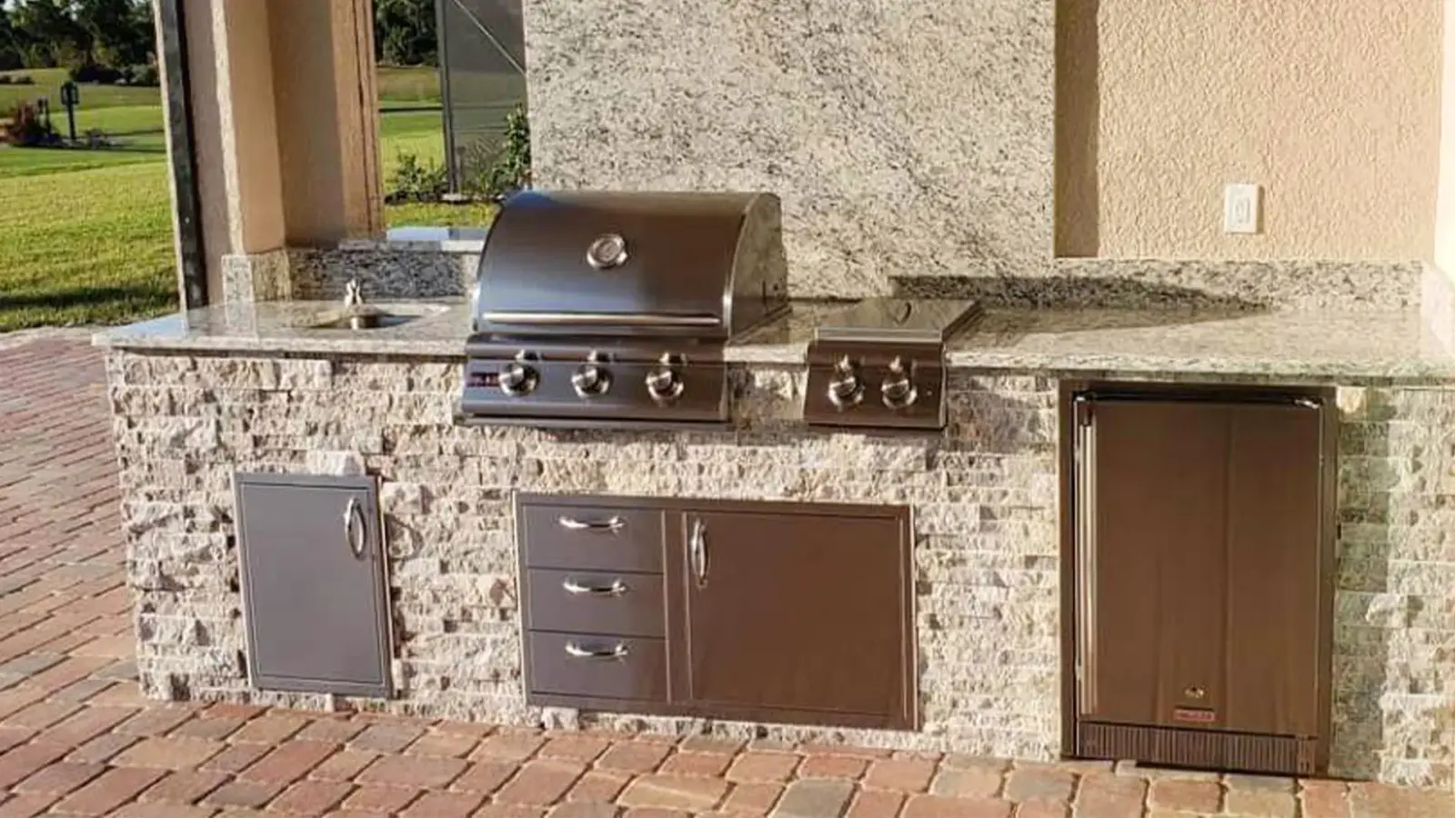 Built-in grill and storage beside the patio