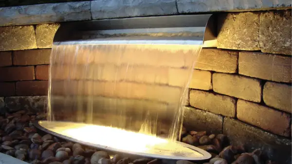 Sheer water feature lit from beneath