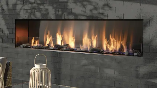 Long linear gas fire feature set into a stone wall